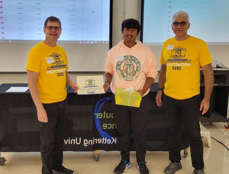 From left, Dr. Babak Elahi, Dean of the College of Sciences and Liberal Arts, Pradham Kuchipudi, fourth-place winner and Dr. Michael Farmer, Head of the Department of Computer Science at Kettering University.